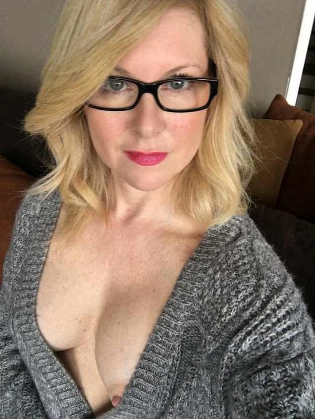 vacant French mom with glasses stripping